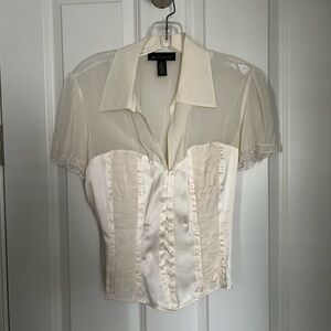 Short sleeve corset style satin and georgette top.